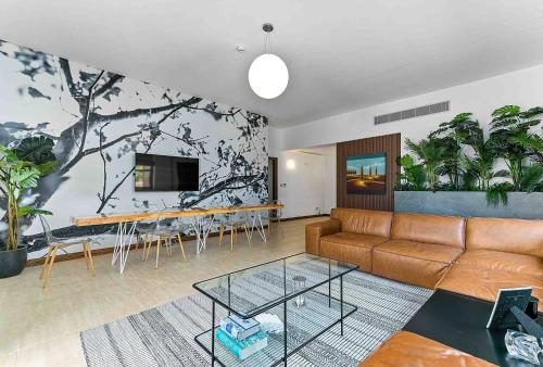 a living room with a couch and a table at Aphrodite Premium Apartments I in Kouklia