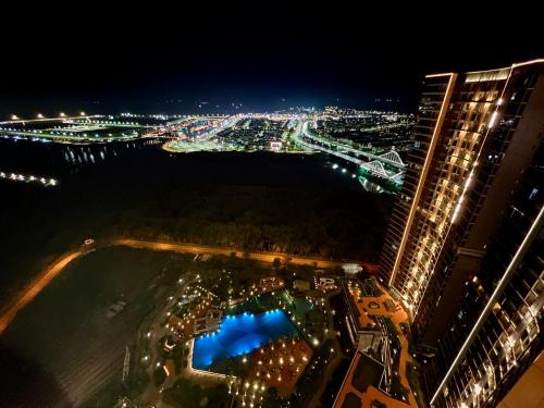 an aerial view of a city at night at Gold Coast Apartment PIK Luxury Sea View by stay with E in Jakarta