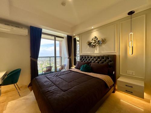 a bedroom with a large bed and a window at Gold Coast Apartment PIK Luxury Sea View by stay with E in Jakarta