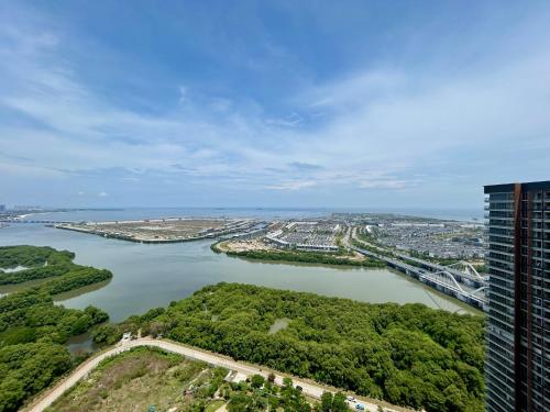 an aerial view of a river and a bridge at Gold Coast Apartment PIK Luxury Sea View by stay with E in Jakarta