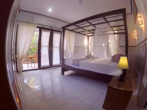 A bed or beds in a room at Pondok Salacca#bamboohouse#