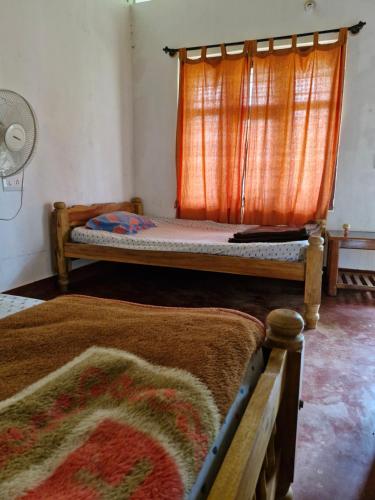 Postel nebo postele na pokoji v ubytování Athena Homestay