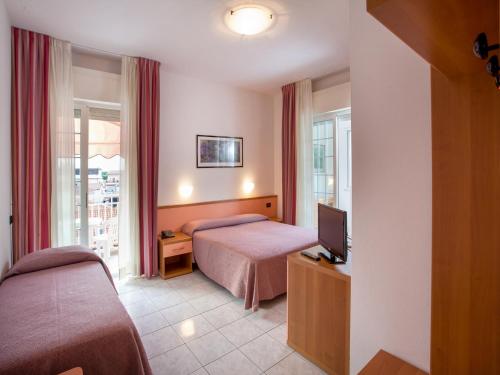Кровать или кровати в номере Hotel Sileoni