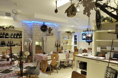 a room with a table and chairs in a room at Da Gianni e Villa Annamaria in Arco