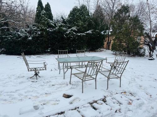 a table and chairs in the snow at The Regal Sanctuary in Niagara Falls