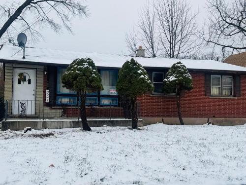 a red brick house with snow on the ground at The Regal Sanctuary in Niagara Falls