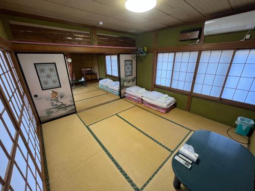 an overhead view of a room with two beds and a table at ふる里 Mt Fuji Inn Furusato in Fujikawaguchiko