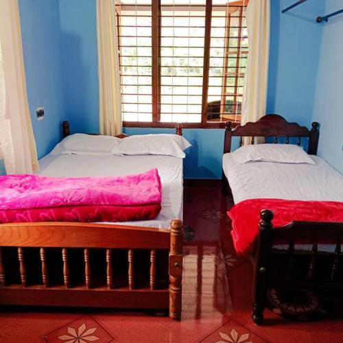 Aghasthyashrya Homestayにあるベッド