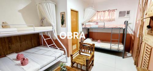 a room with two bunk beds in a room at ROCCA Del GARDA Residences in Binangonan