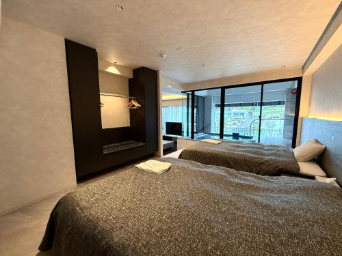Dog Hotel Shirahama ドッグホテル シラハマにあるベッド