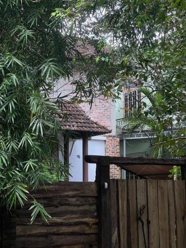 a wooden fence in front of a house at mehome in Cư Chinh