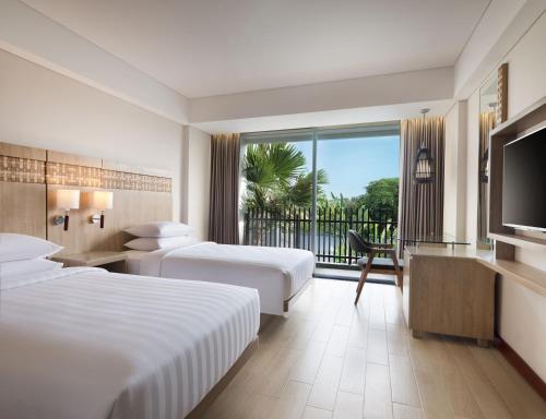 Ένα ή περισσότερα κρεβάτια σε δωμάτιο στο Fairfield by Marriott Bali Legian