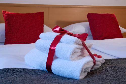 Postel nebo postele na pokoji v ubytování GH Hotel Piaz