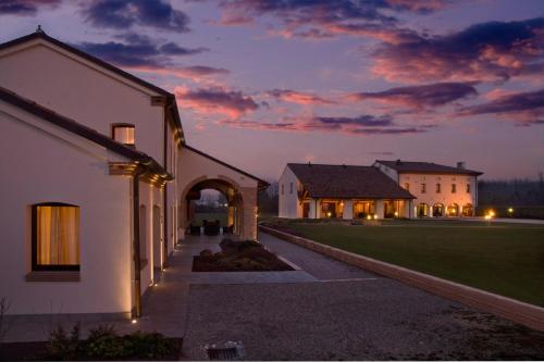 an estate at night with the lights on at Annia Park Hotel Venice Airport in Tessera