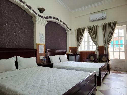 Postel nebo postele na pokoji v ubytování HOME Hotel