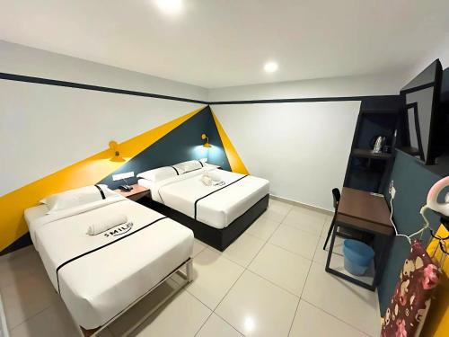 Postel nebo postele na pokoji v ubytování Smile Hotel Balakong Kajang