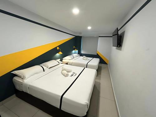 Postel nebo postele na pokoji v ubytování Smile Hotel Balakong Kajang