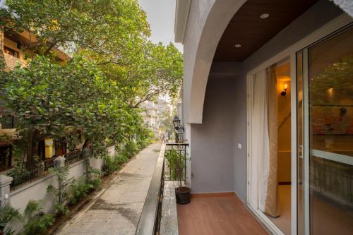 an empty hallway of a building with trees on a street at ELIVAAS Solace Azure 4 BHK Villa with Pvt Pool in Calangute