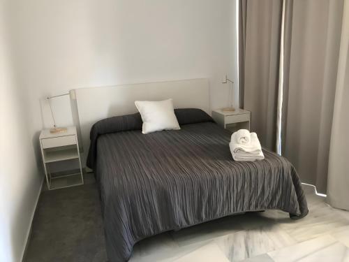 Postel nebo postele na pokoji v ubytování Marbella House Penthouse