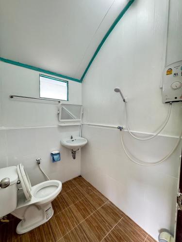 a bathroom with a toilet and a sink at Rimtalay Resort Koh Si Chang in Ko Si Chang