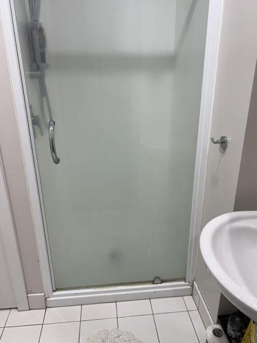 a bathroom with a shower and a sink at Auckland city central apartment 2 bedrooms apartment Wi-Fi balcony harbor or skytower view near public parking 1204 in Auckland