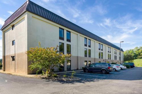a large building with cars parked in a parking lot at Quality Inn Danville - University Area in Danville