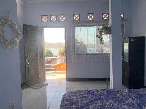 Ένα ή περισσότερα κρεβάτια σε δωμάτιο στο Hans Surfer Homestay