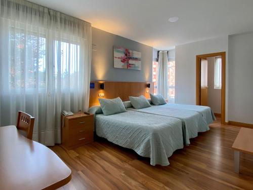 Ένα ή περισσότερα κρεβάτια σε δωμάτιο στο Hostal RIO SELMO