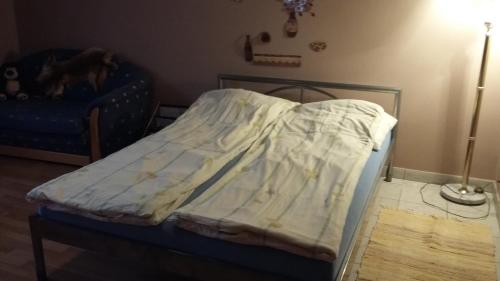 Ένα ή περισσότερα κρεβάτια σε δωμάτιο στο Norbi Apartmanok