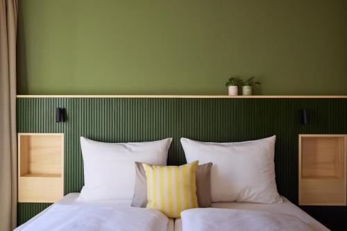 Postel nebo postele na pokoji v ubytování Hotel UND - smart alpine stay