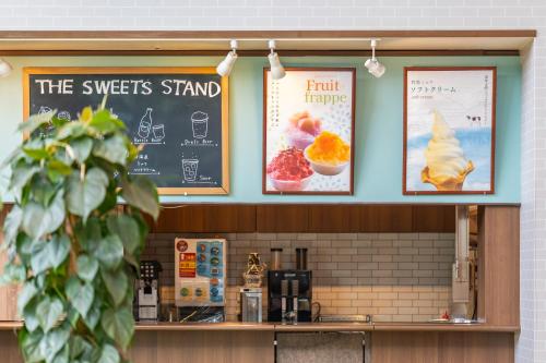 a restaurant with a chalkboard and signs on the wall at -SPA RESORT- Nagoya Kasadera Hotel in Nagoya