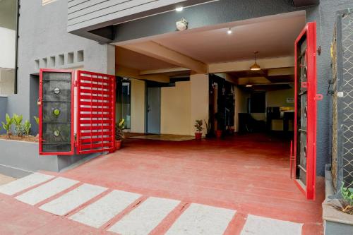 a red door on the side of a building at Super Hotel O Whitefield in Bengaluru