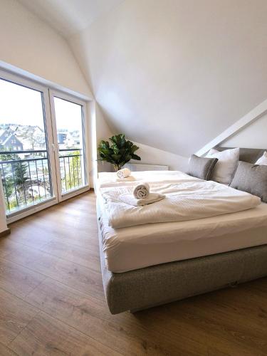 Postel nebo postele na pokoji v ubytování Winterberg Appartement 21135