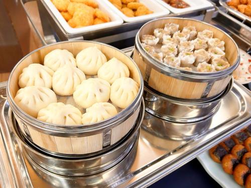 a buffet of donuts and other pastries on display at Shuzenji Onsen Hotel Takitei in Izu