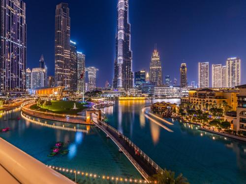 a view of a city skyline at night at the Byron Bay condo in Dubai