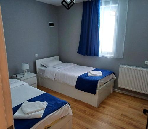 Postel nebo postele na pokoji v ubytování Gablile apartments