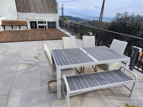 a table and chairs sitting on a balcony at A+View Private Terrace Private Pool Family Fun in Badalona