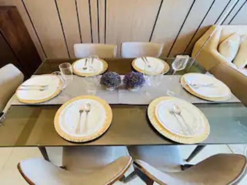 a table with white plates on top of it at LaFayette Park Square in Iloilo City