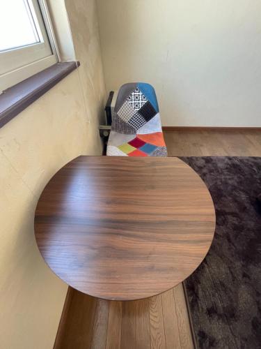 a wooden table in the corner of a room at TrainLineField in Tōbetsu