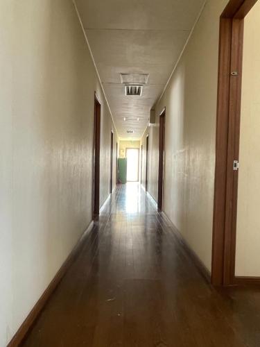 an empty hallway in an office building at TrainLineField in Tōbetsu