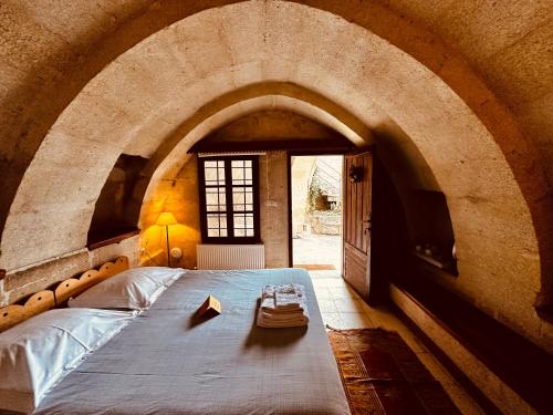 Ένα ή περισσότερα κρεβάτια σε δωμάτιο στο Les Maisons De Cappadoce