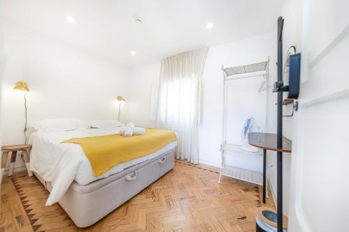 Postel nebo postele na pokoji v ubytování Casa dos Cucos