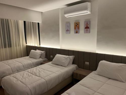 Ένα ή περισσότερα κρεβάτια σε δωμάτιο στο Nilefront Cozy Escape