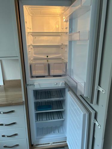 an empty refrigerator with its door open at Northgate House in Chester