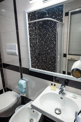 Koupelna v ubytování Hotel Aria