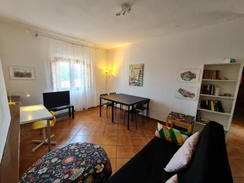 a living room with a couch and a table at Amazing escape in tuscany in Chiesina Uzzanese
