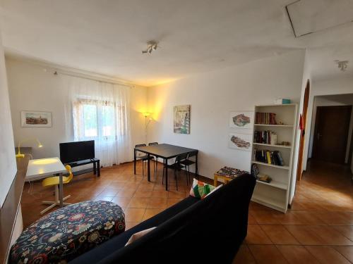 a living room with a couch and a table at Amazing escape in tuscany in Chiesina Uzzanese