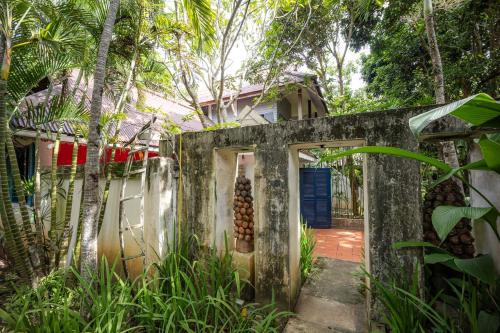 an entrance to a house with a blue door at 11 Rooms in Chiang Dao