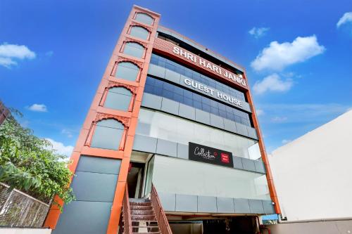 a tall building with a sign on the side of it at Collection O Elite in Dehradun