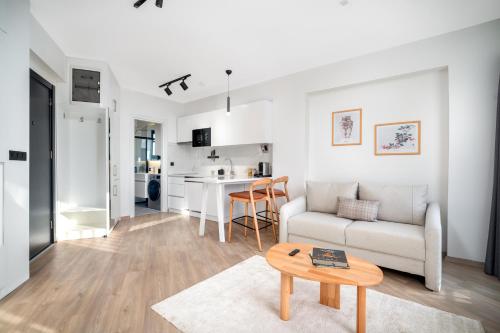 a living room with a couch and a table at Urban Quarters - Firuzağa in Istanbul